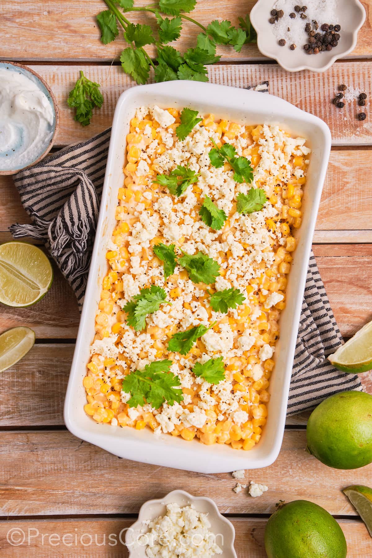 Baked street corn casserole garnished with fresh cilantro.