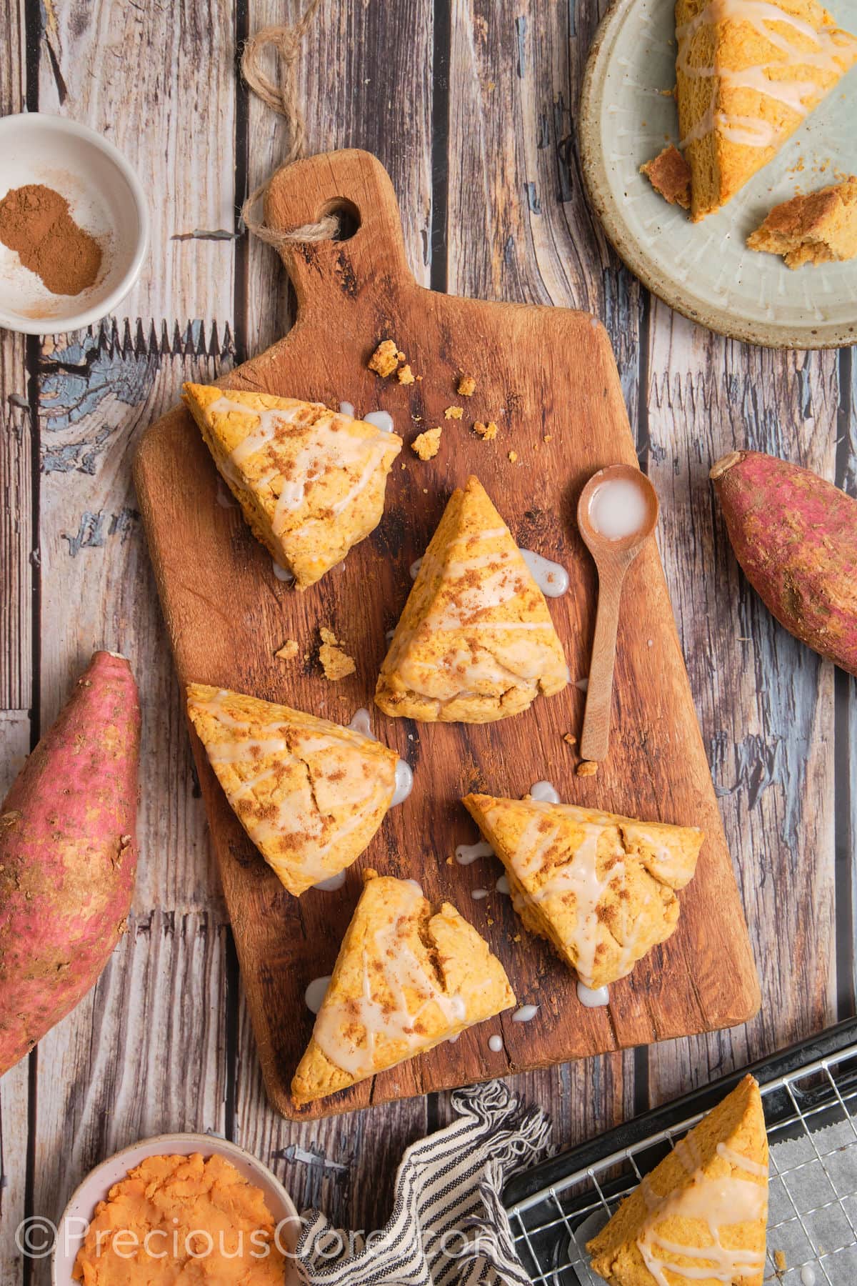 Baked scones on a chopping board.