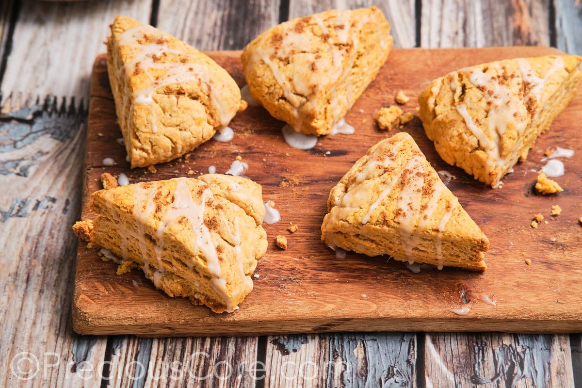 Homemade scones on a chopping board.