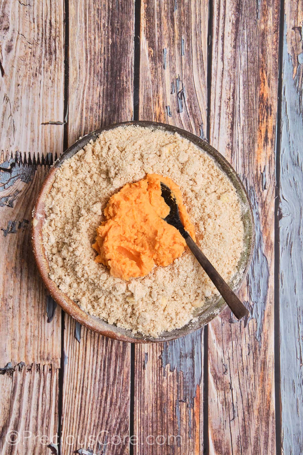 Adding sweet potato mixture to flour mixture.