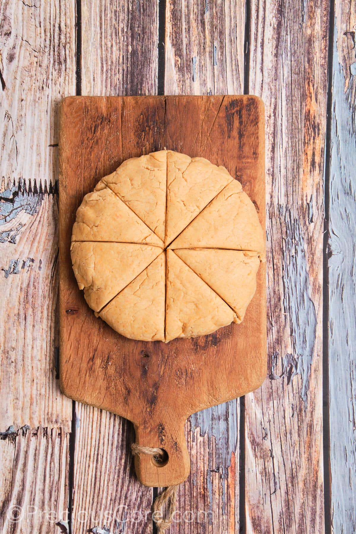 Round shaped dough cut into 8 wedges.