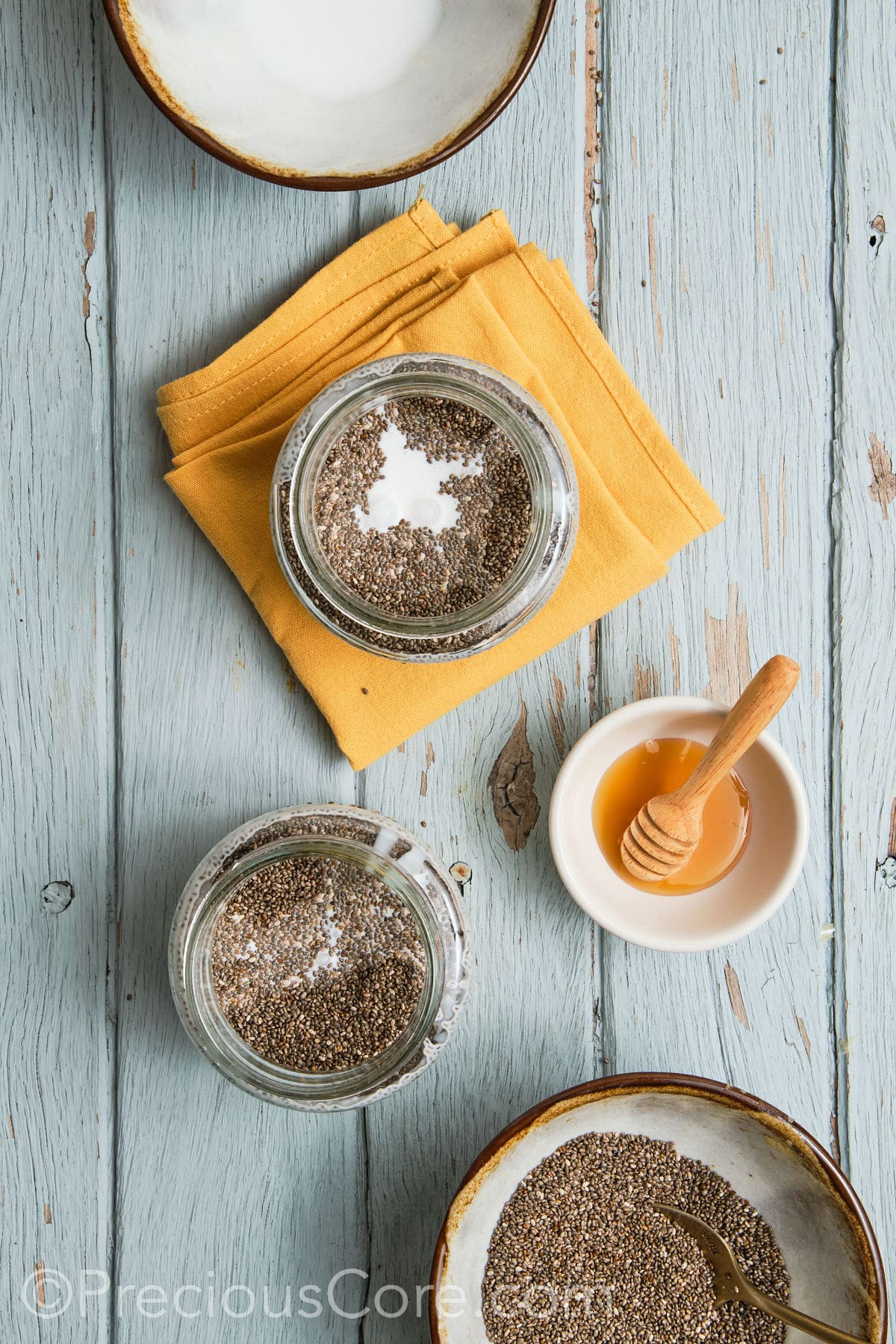 Milk and other ingredients added to glass jar.