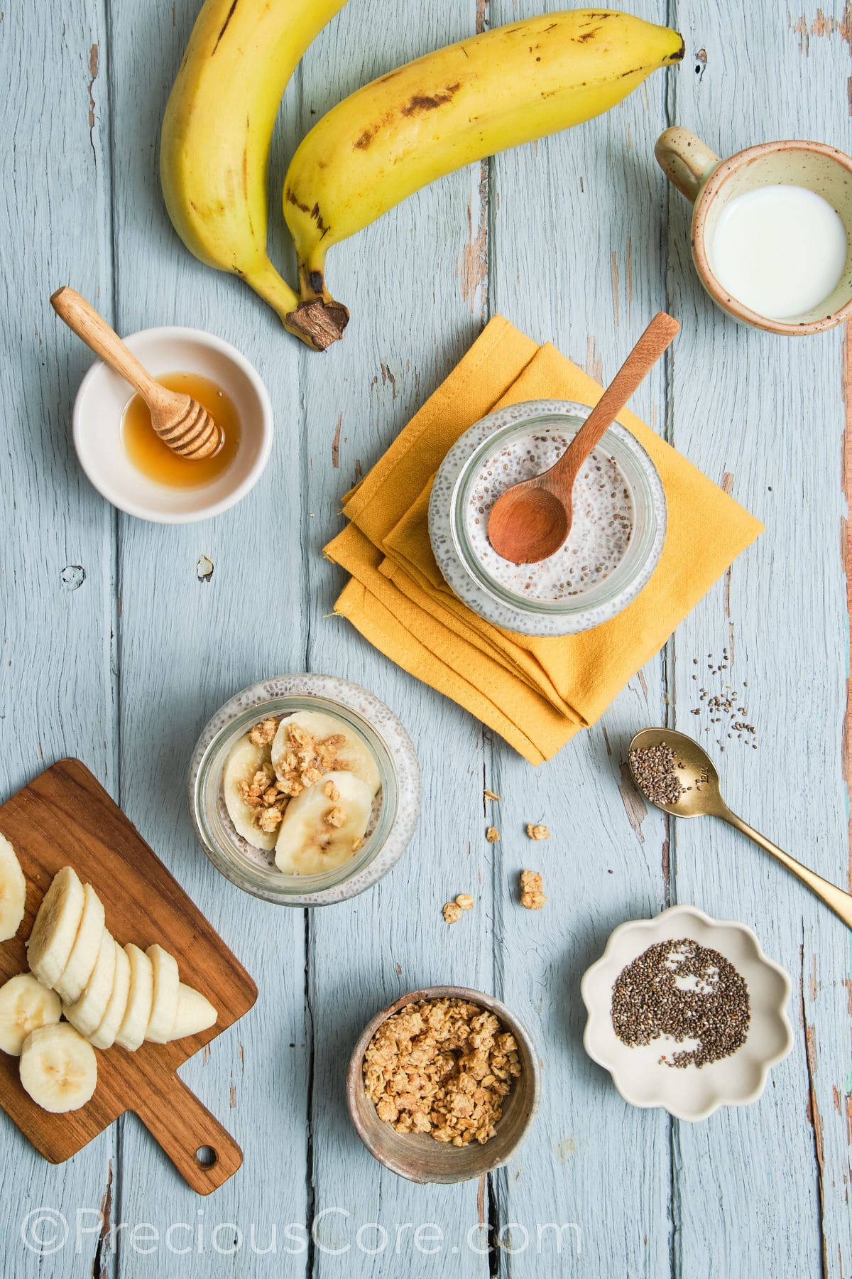 Banana chia seed pudding topped with banana slices and walnuts.