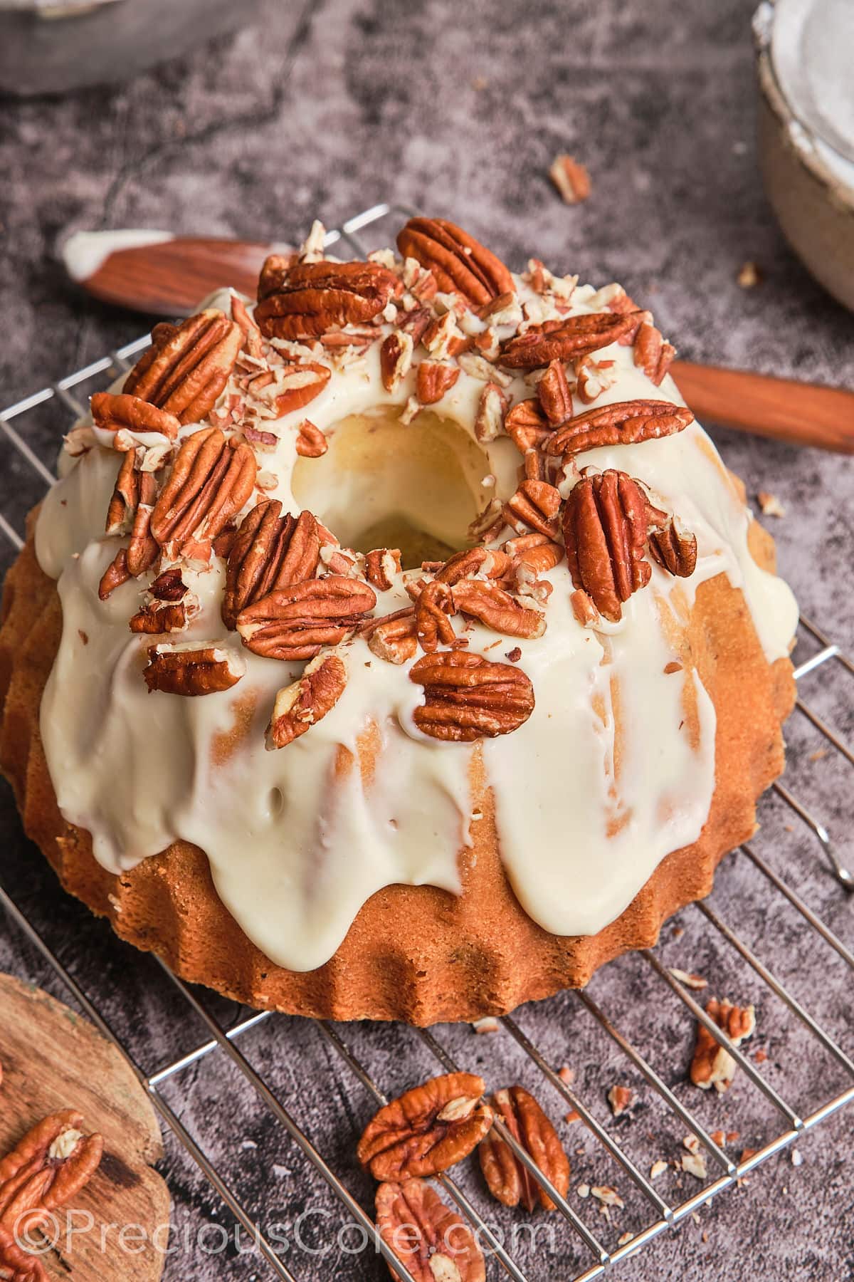 Pound cake covered with a creamy frosting and pecans.