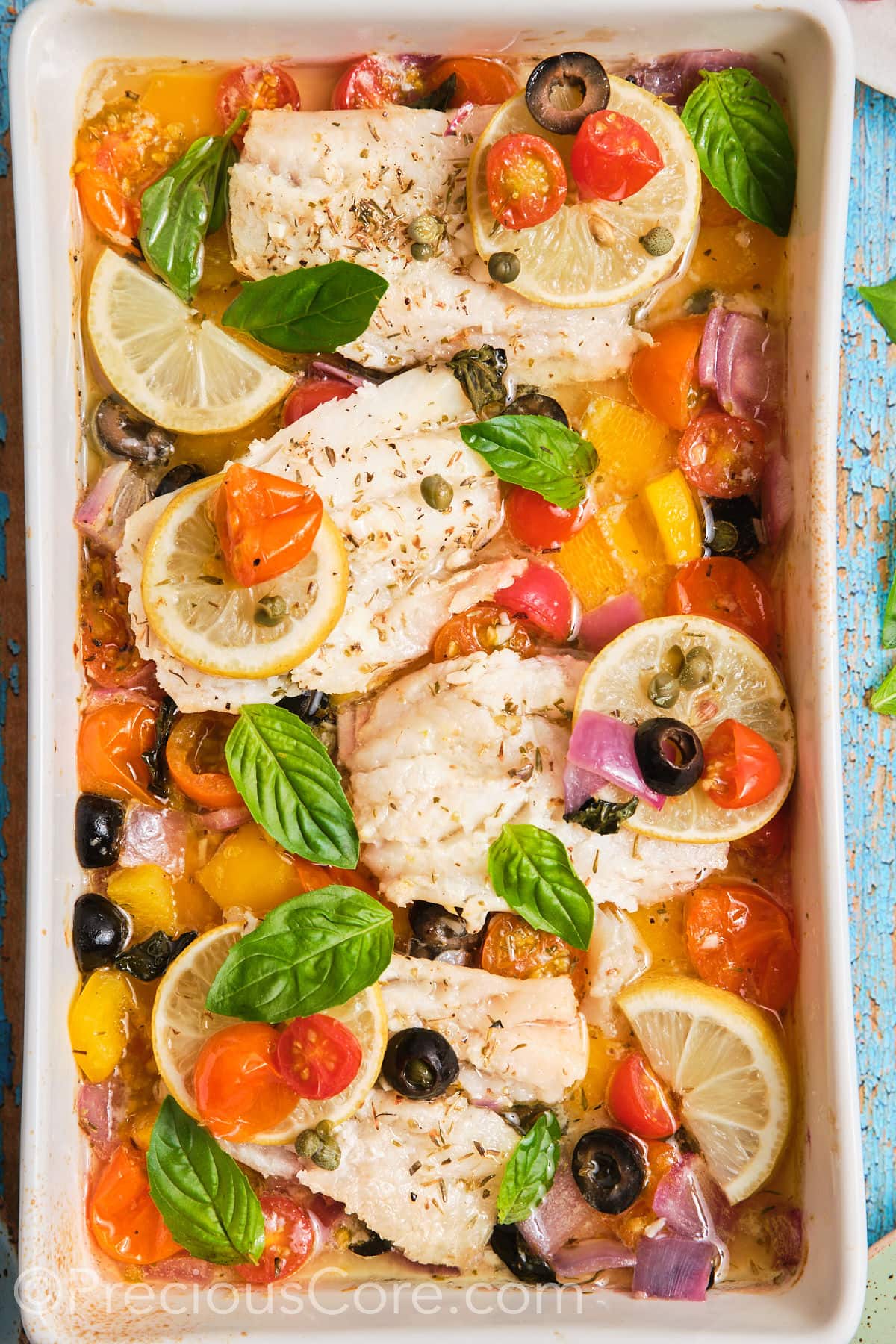 baking dish with Mediterranean baked fish. 