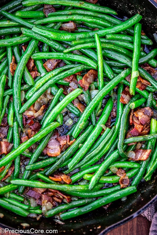 Pan of green beans with bacon.